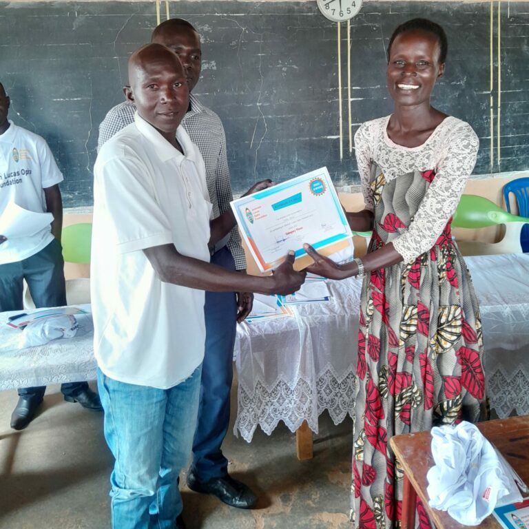 Oweka Alfred, Category 3, recieved a Special Recognition Award for being the only participant writing their essay in vernacularLuo.