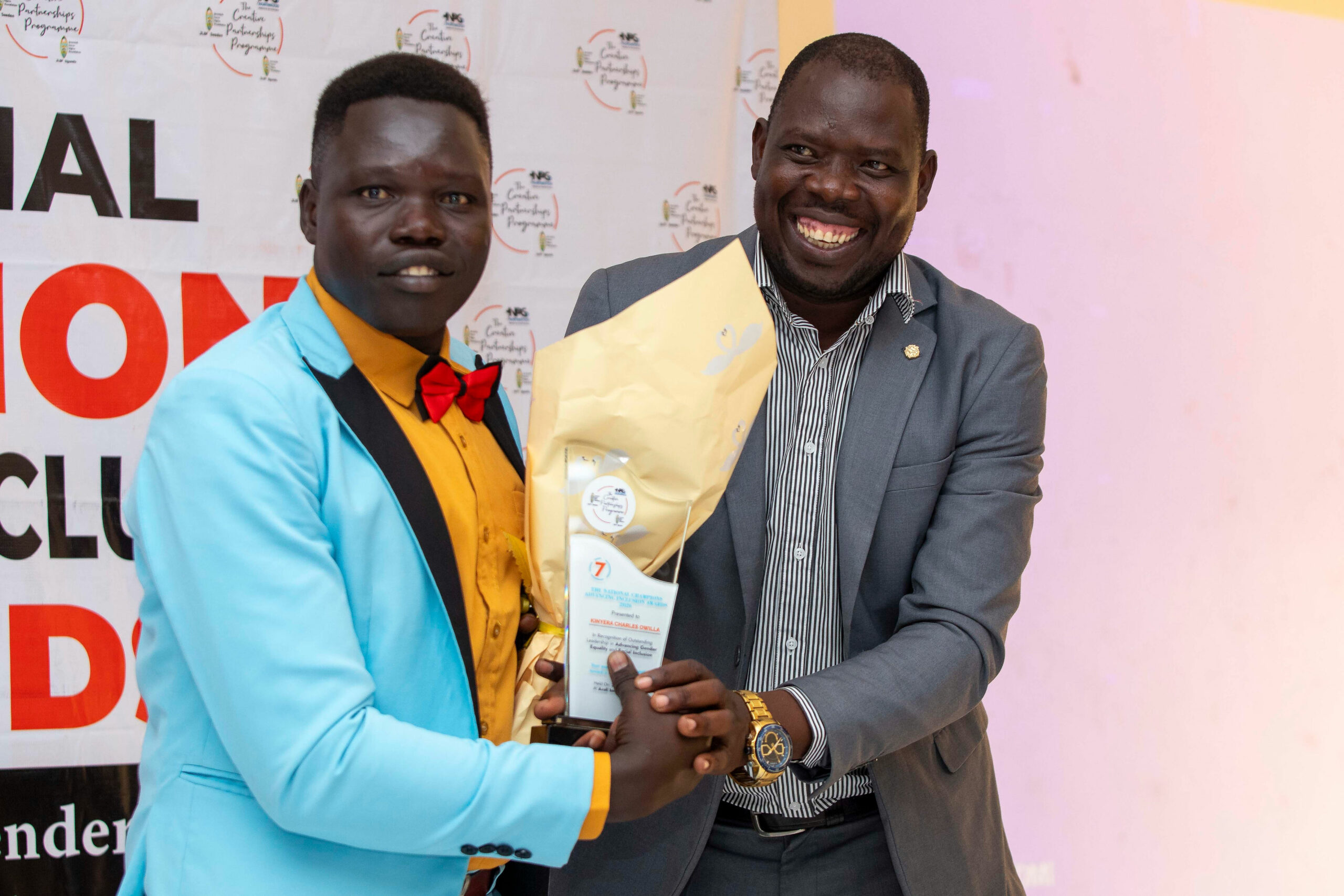 L-R: Winner Charles Owilla Kinyera, Hon.  Okoya John Calvin